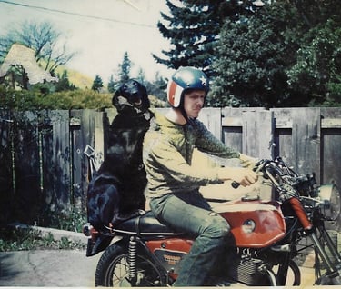 Man and dog on motorcycle