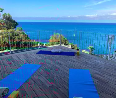yoga class on terrace at hotel kalura in sicily facing the sea - yoga mats for asana