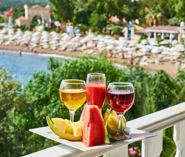 Healthy food travel destinations - a tray with fruit and wine glasses on a balcony