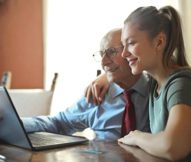 Long lasting relationships and longevity - a man and woman sitting at a table with a laptop