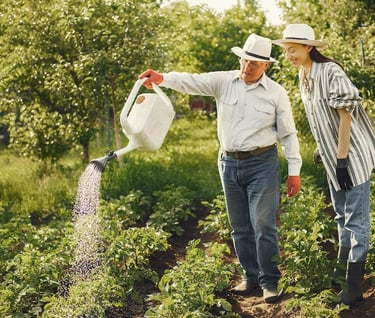 a man and woman watering in a garden as for personal growth