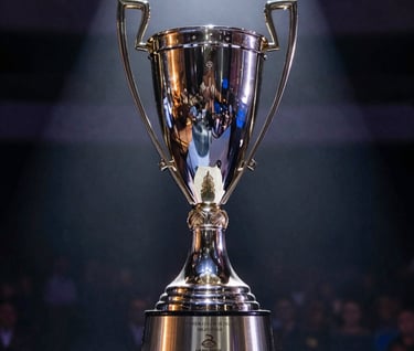 A low-angle, sharp focus shot of the tournament championship trophy sitting on a pedestal, illuminated by a single spotlight. The aesthetic is extremely clean and professional, reflecting the brand mood.