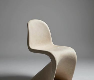 A sculptural studio chair in a void-like space with sharp edges and soft gray shadows. Premium editorial aesthetic, minimal composition, Global / Contemporary Art.