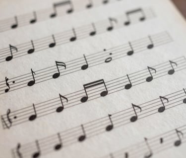 Abstract composition of musical notes on a sheet, dusty rose and antique white colors, soft focus, professional music photography.
