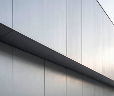 Minimalist architectural detail of a modern studio in a Central European / German city, featuring light silver grey walls and clean geometric lines, soft natural lighting.
