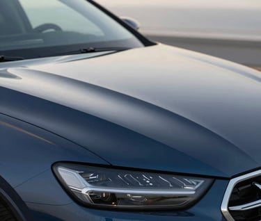 A close-up 'After' shot of the same navy metallic car hood, now perfectly smooth with no sign of the dent, reflecting a clean horizon, professional and polished.