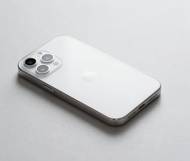 Commercial photography of a sleek minimalist tech gadget on a light gray surface. Precise focus and luxury feel with clean white lighting. International / Professional.