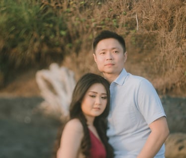 Intimate couple portrait in soft sunset light at Pantai Nyanyi Bali.