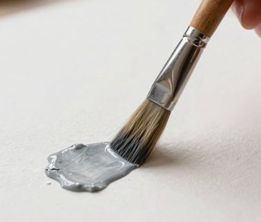 Close-up detail shot of a watercolor brush applying #A89B90 paint to thick, elegant paper, conveying craftsmanship and artistry.