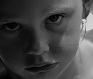 Close up of a young girl looking directly into the camera