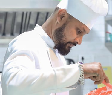 a chef in a white chef's hat and a chef's hat