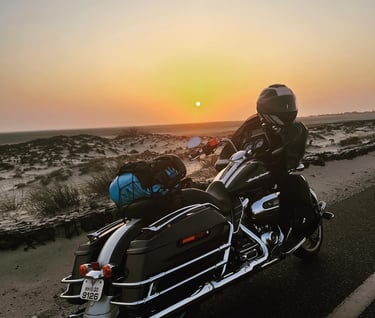 a man riding a motorcycle on a road