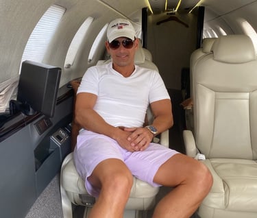 Rick Rockefeller-Silvia sitting in a private jet