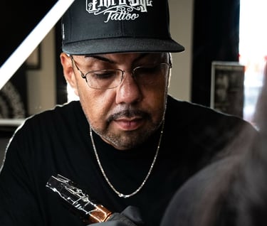 A man tattooing at work