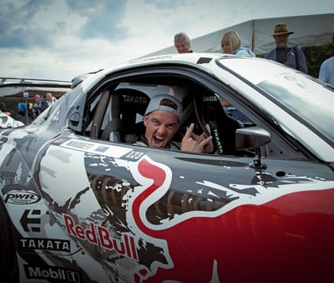 Mad Mike greeting me at the Goodwood Festival of Speed whilst sitting in his Mazda RX7 in 2015