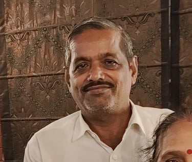 a man and woman standing in front of a wall