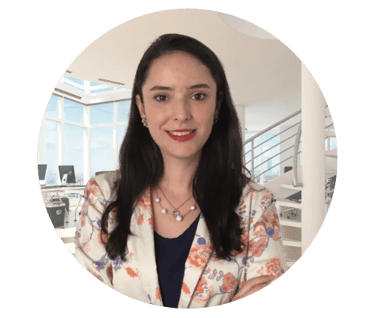 a lawyer woman in a floral jacket and necklace