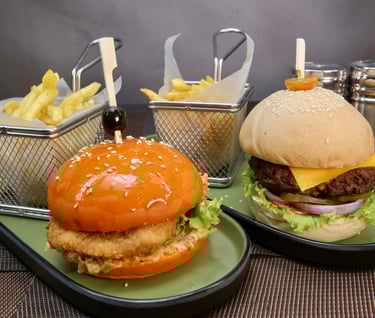 two plates of beef and chicken burger