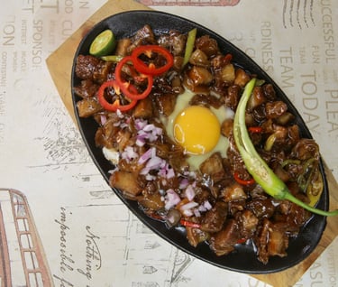 a plate of sizzling sisig
