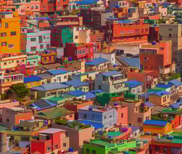 wallpaper - a large city with many colorful buildings and a clock tower