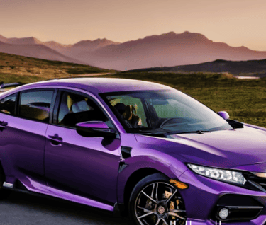 a purple Honda Civic parked on a road with mountains in the background