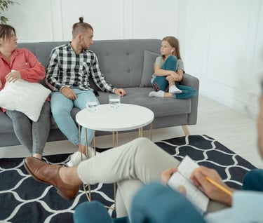 Homeopath is observing the behaviour of patient with family while taking cade history