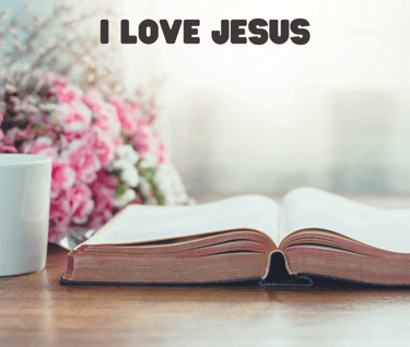 bible on table with pink flowers