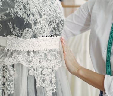 a woman working with a wedding dress