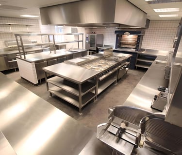 Fully equipped kitchen with gleaming Prosumer grade stainless steel appliances and surfaces.