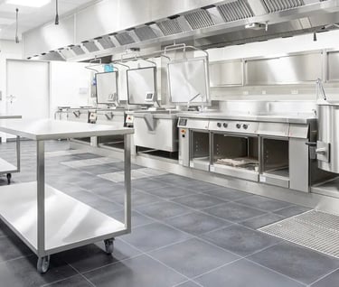 Mobile stainless steel bench Perth in a modern commercial kitchen.