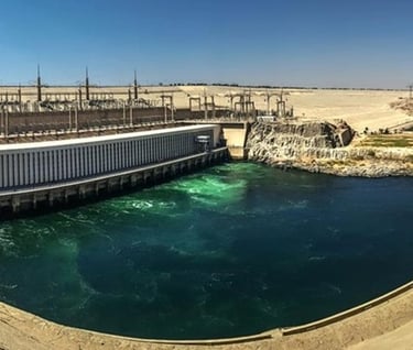 a dam of water flowing over a dam in the middle of a desert