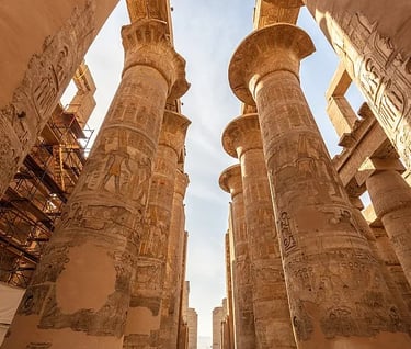 a group of people standing in front of a tall column