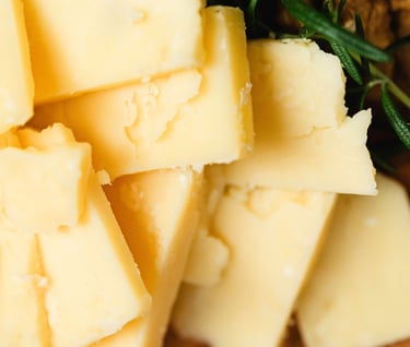 Cheddar slices on a board