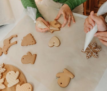 Women decorating holiday cookies