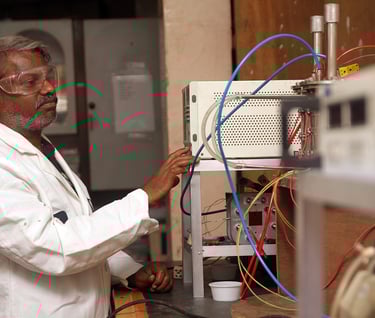 a man in a lab coat and glasses