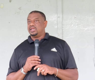 Aaron Winston Jr. speaking at Brittany Woods event