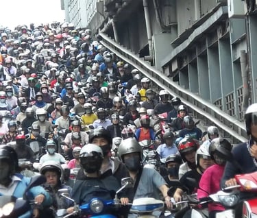 a large group of people riding on motorbikes