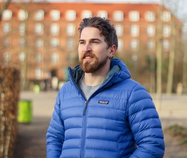 the blog owner with a blue jacket portrait