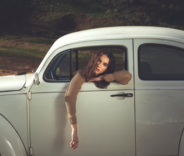 a woman leaning out of a car window
