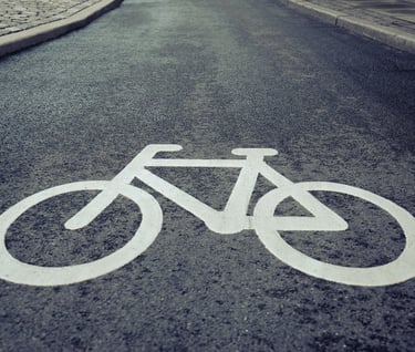 a bicycle lane lane sign on a street