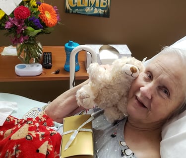 Lady hugging teddy bear