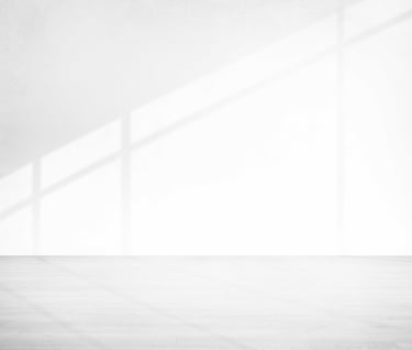 a black and white photo of a room with a window
