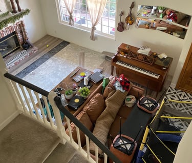 View from our upstairs landing - the entire living room has been moved around. Concrete slab below