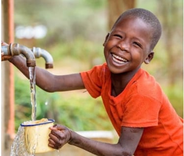 Luxeana Kenya for Sustainable water, a child on water tap
