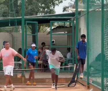 Coach Cesar working with ITF player