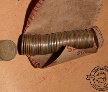 a coin - roll with a Lincoln cent penny coin and a coin