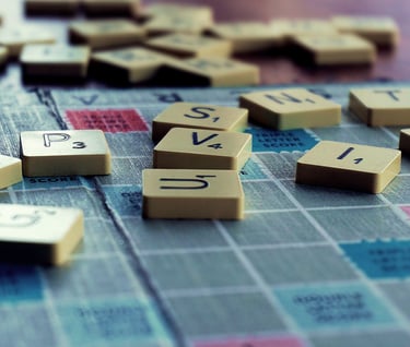 Data - Scrabble game board with several letters on it - Data - From Latin to English to French