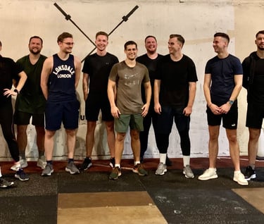 a group of people standing in front of a wall