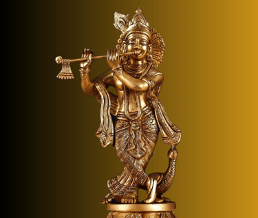 Statue of a Hindu god, Krishna, playing a flute