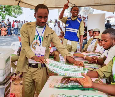 a corp member of the NYSC handling a ballot paper